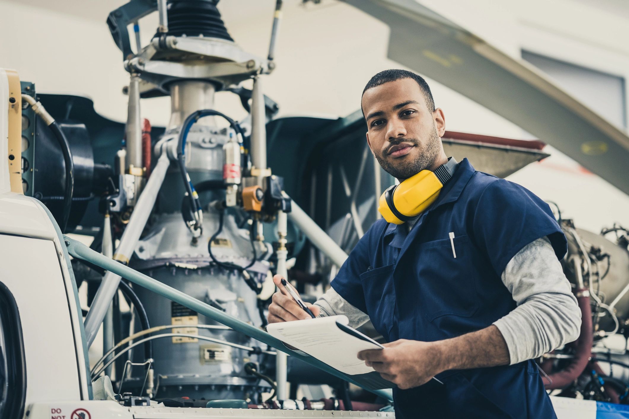 Industrial maintenance technician with clipboard