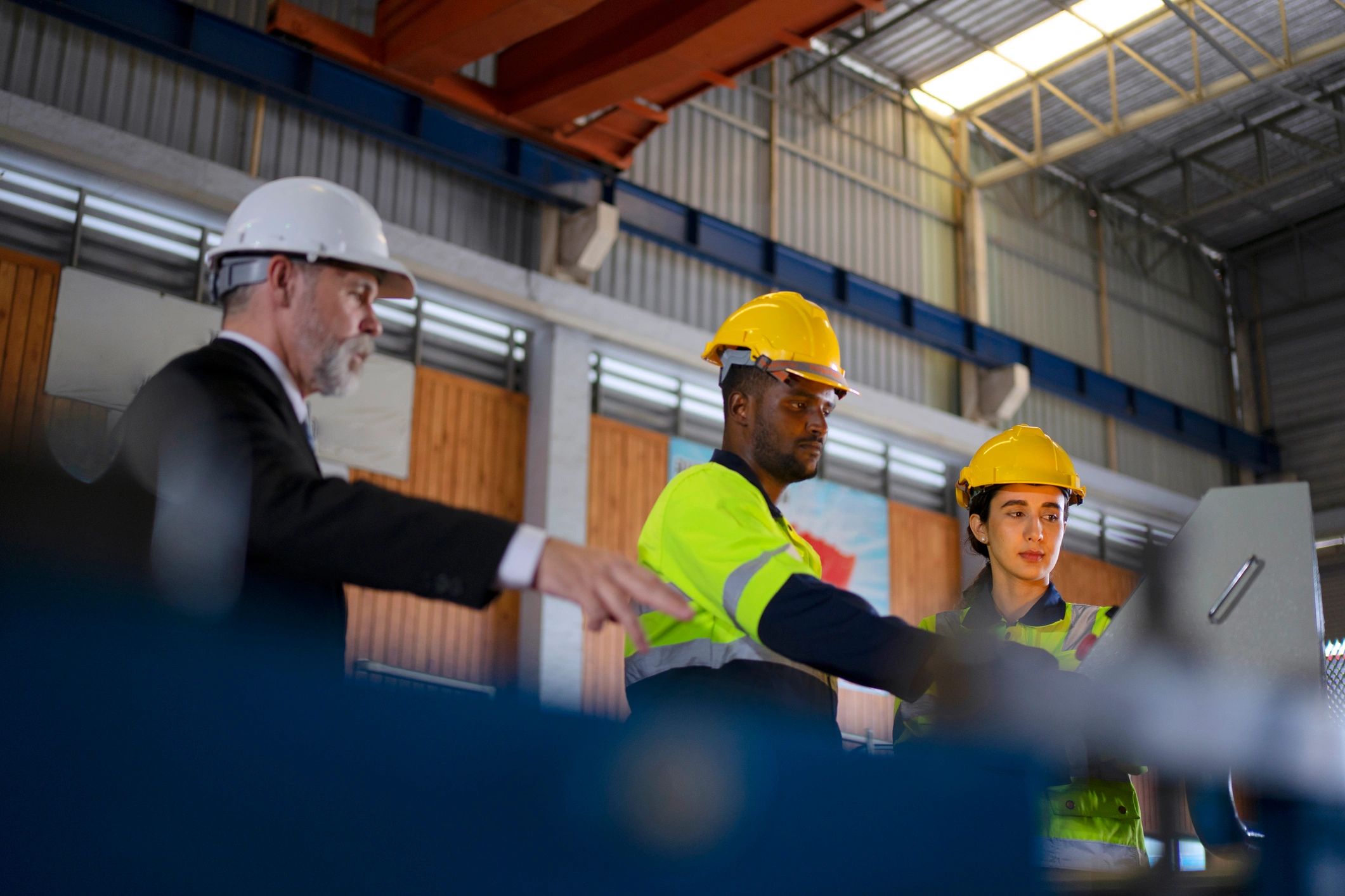 Engineer in an industrial facility reviewing operations