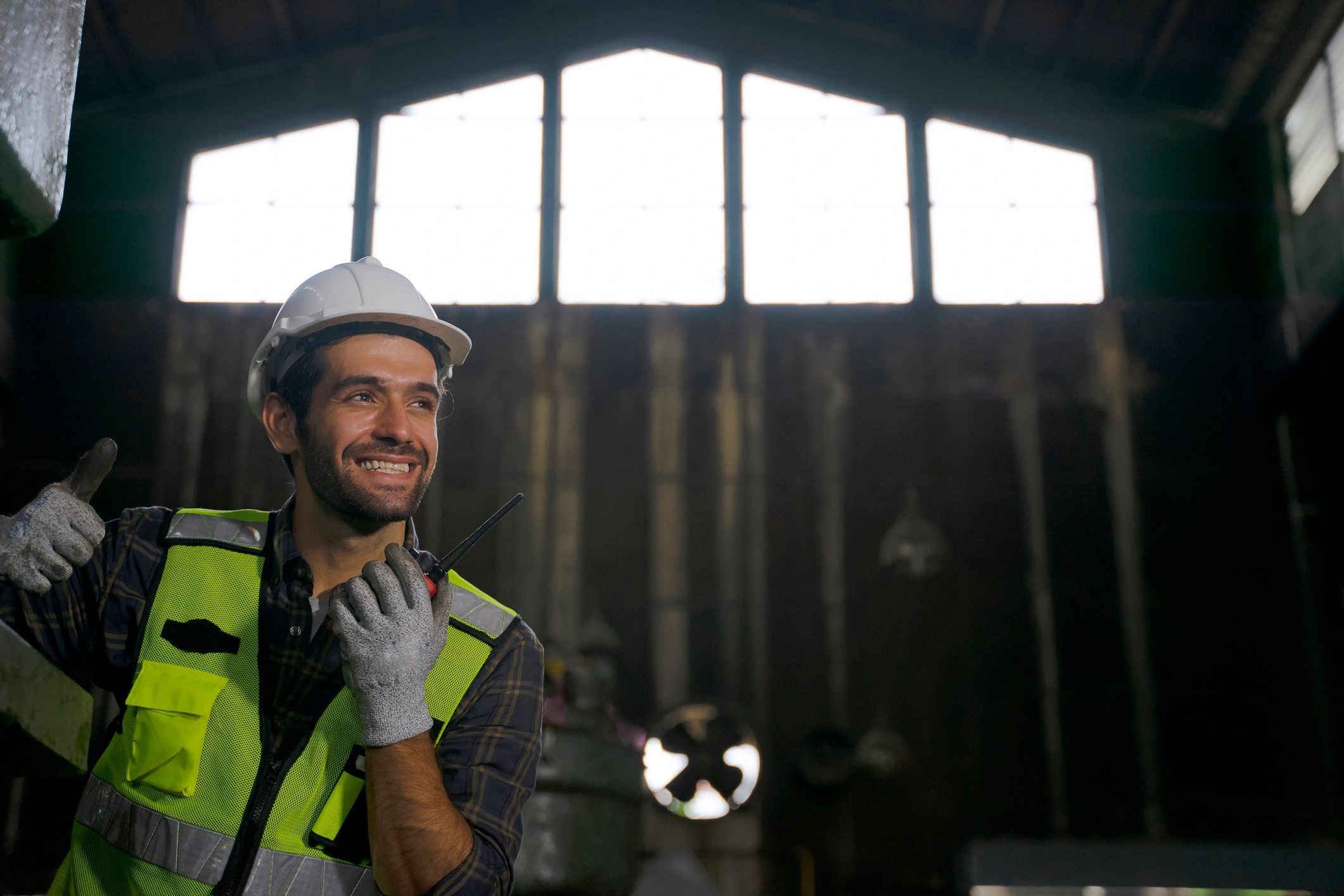 Industrial technician working at heavy machinery in a factory