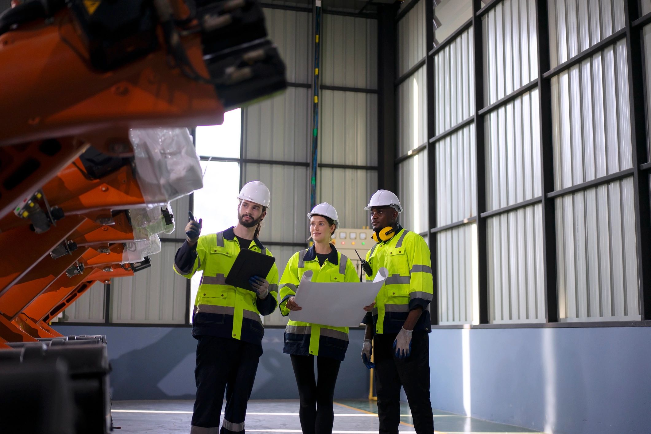 Engineer inspecting equipment in an industrial facility
