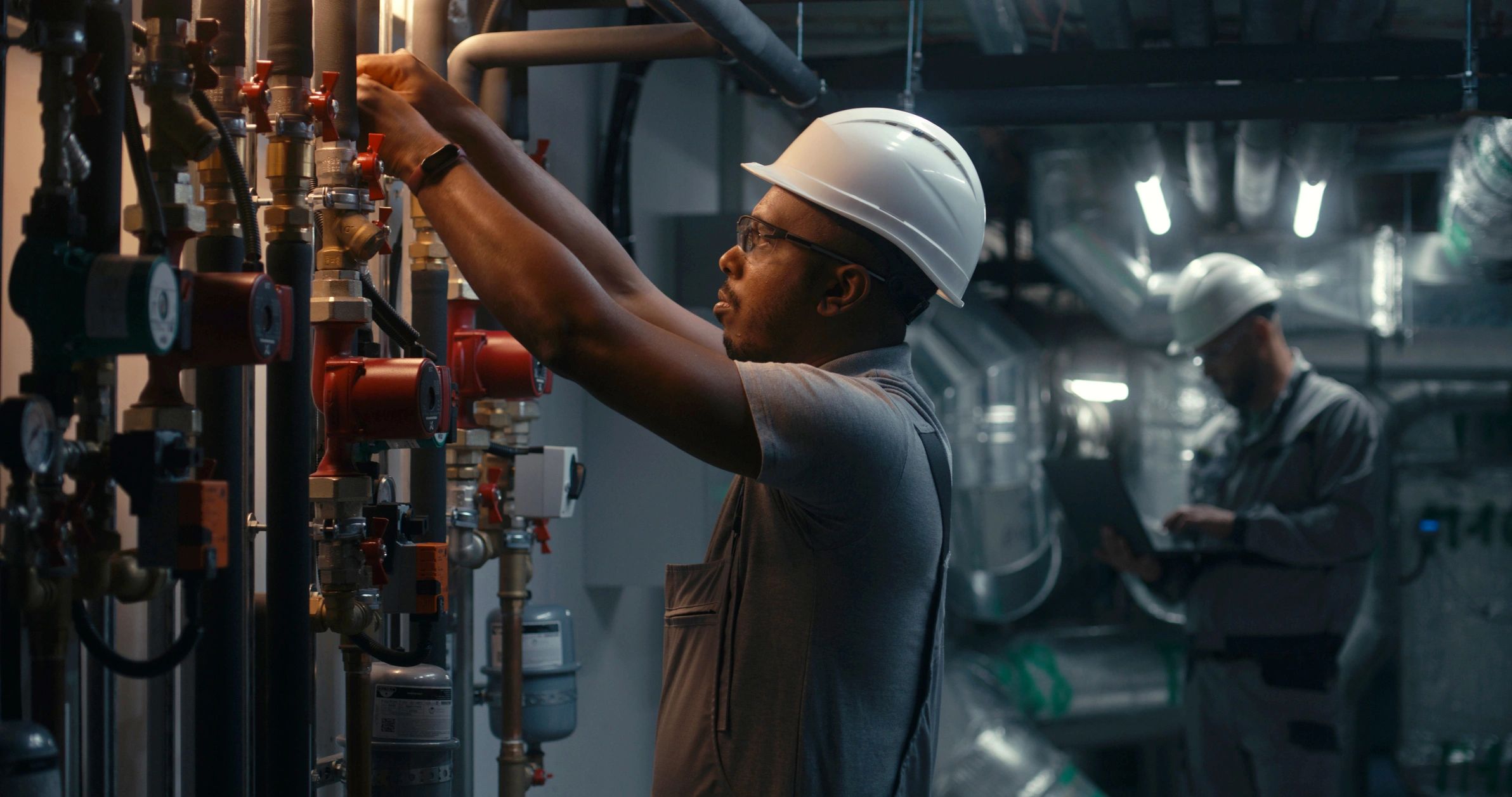 Industrial technician inspecting plant systems